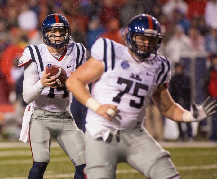 Ole Miss QB Bo Wallace wearing the now-retired white jersey with navy accents against Arkansas in 2014.